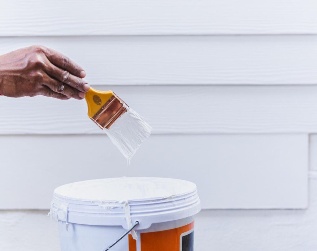 Painter near me in Grand Blanc, MI applying fresh paint with smooth finishes