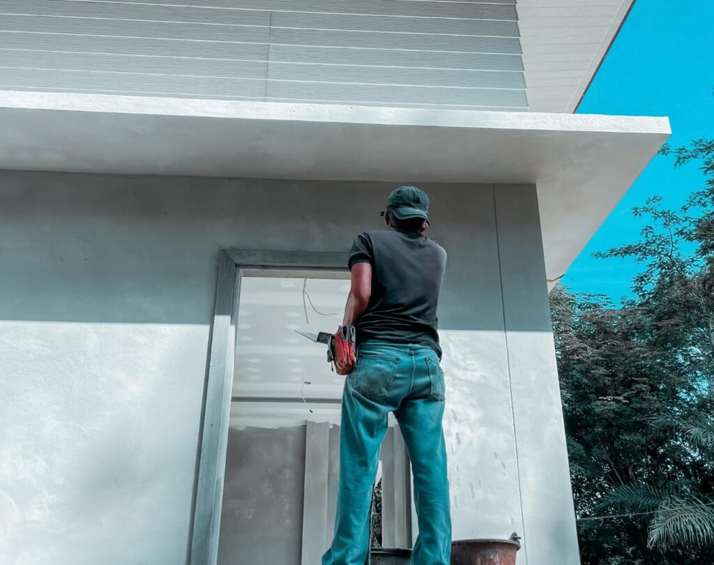 Professional painter in Grand Blanc, MI completing a residential painting project